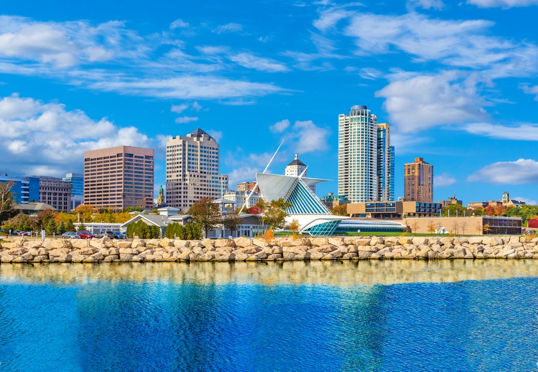 a large body of water with a city in the background